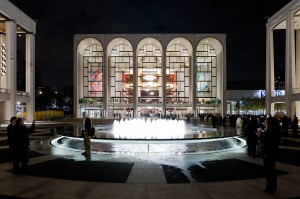 Lincoln Center Plaza scene: theater illuminated at night. LSU interior design alumni work by lighting designer Suzan Tillotson